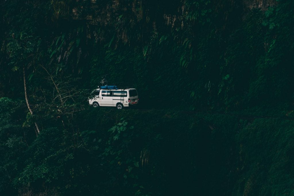 White van driving along Death Road in Bolivia